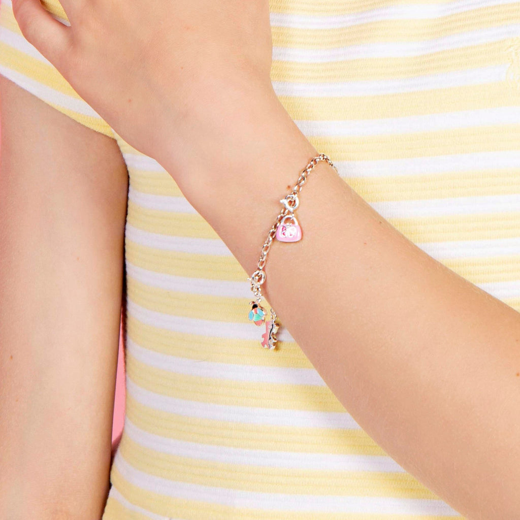 Children's Adjustable silver Charm Bracelet worn by Tween girl in a Yellow and White Strip top