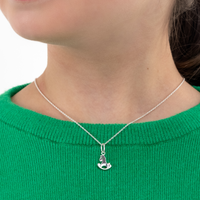 Tween girl wearing a Toy Horse Necklace and Toy Horse Earrings in Sterling Silver wearing a green sweater